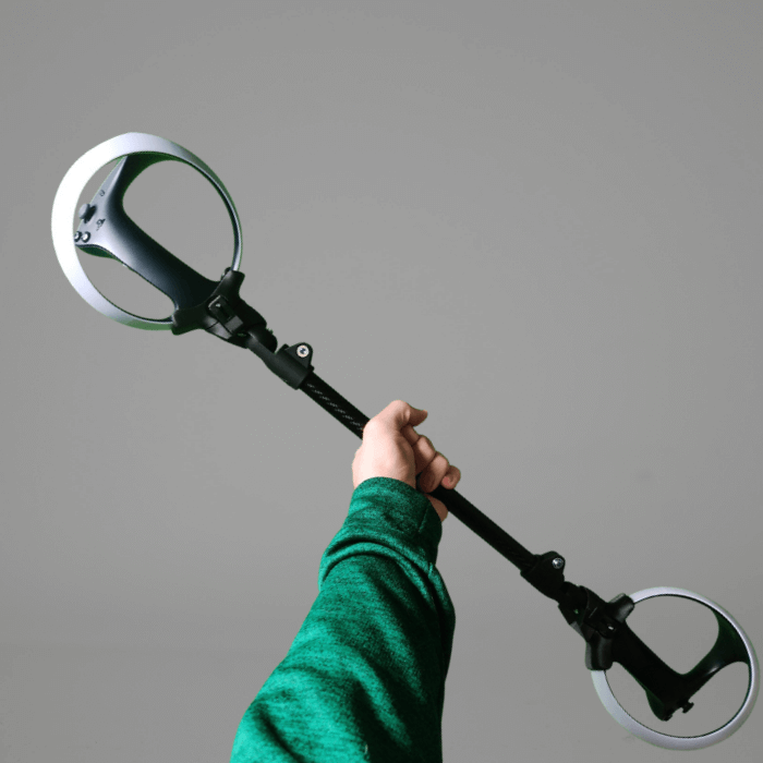 a prosaber paddle for playstation psvr 2 hold by an someone wearing a green sleeve